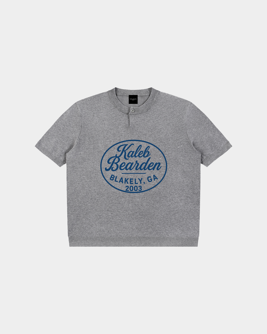 Kaleb A. Bearden Blakely Henley Tee in soft fabric, featuring a buttoned neckline and casual fit, shown in a neutral color.