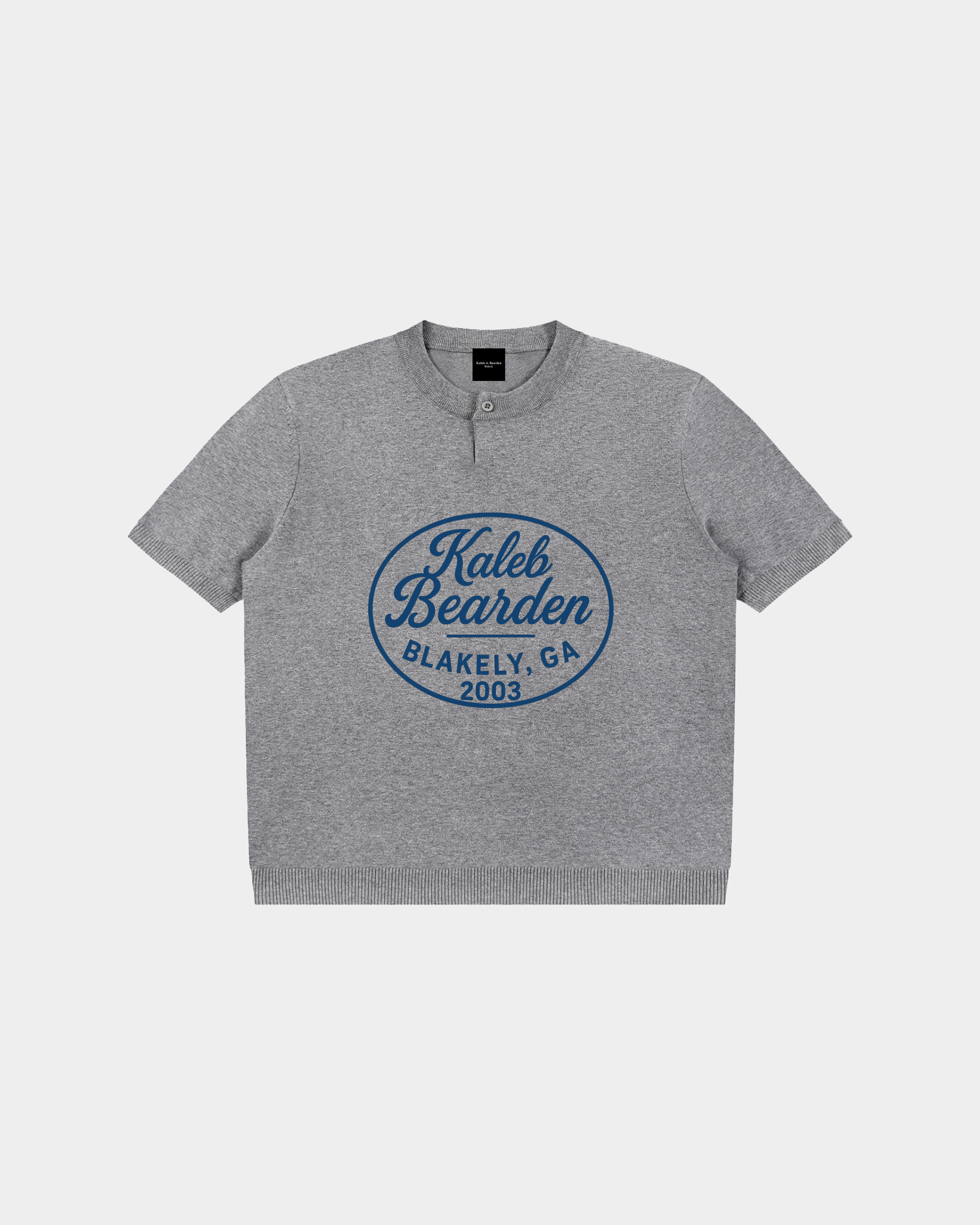 Kaleb A. Bearden Blakely Henley Tee in soft fabric, featuring a buttoned neckline and casual fit, shown in a neutral color.