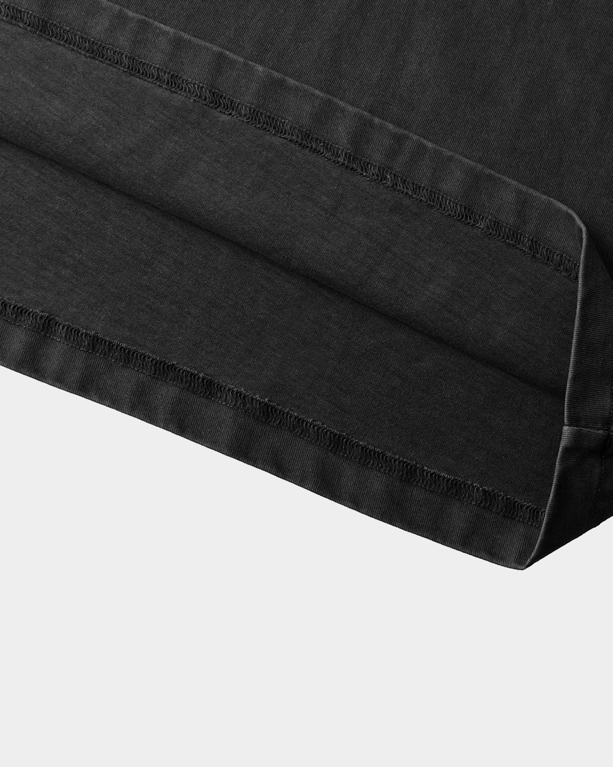 Black studded T-shirt by Kaleb A. Bearden featuring metal studs and a casual fit, displayed on a flat lay.