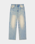 Sun-faded denim pants by Kaleb A. Bearden featuring a relaxed fit and distressed details, shown hanging on a wooden hanger.