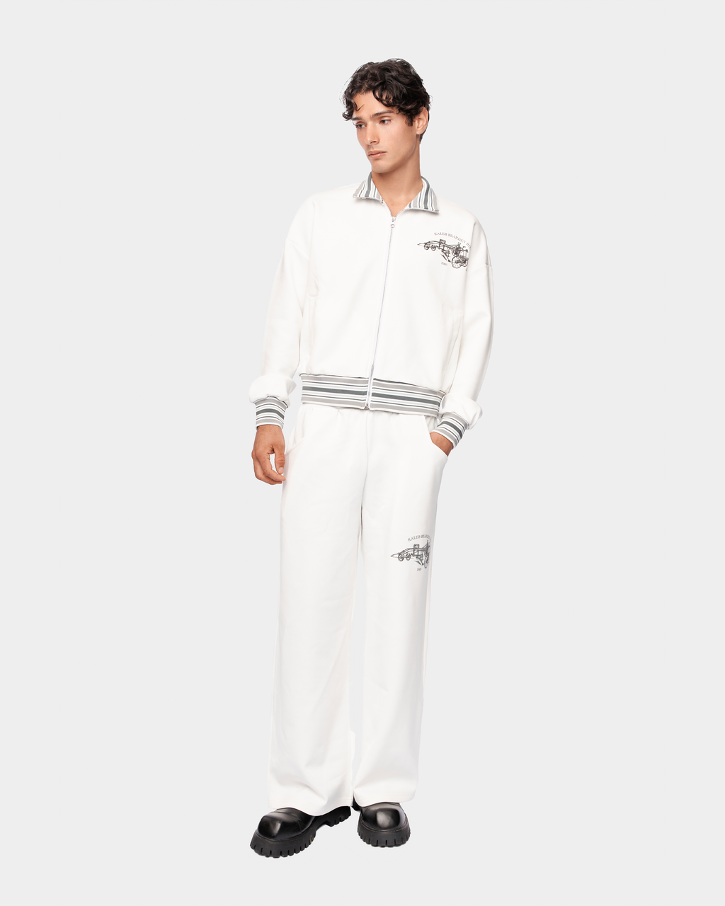 Kaleb A. Bearden Signature Track Pant in black with white side stripes, comfortable athletic joggers for casual wear.