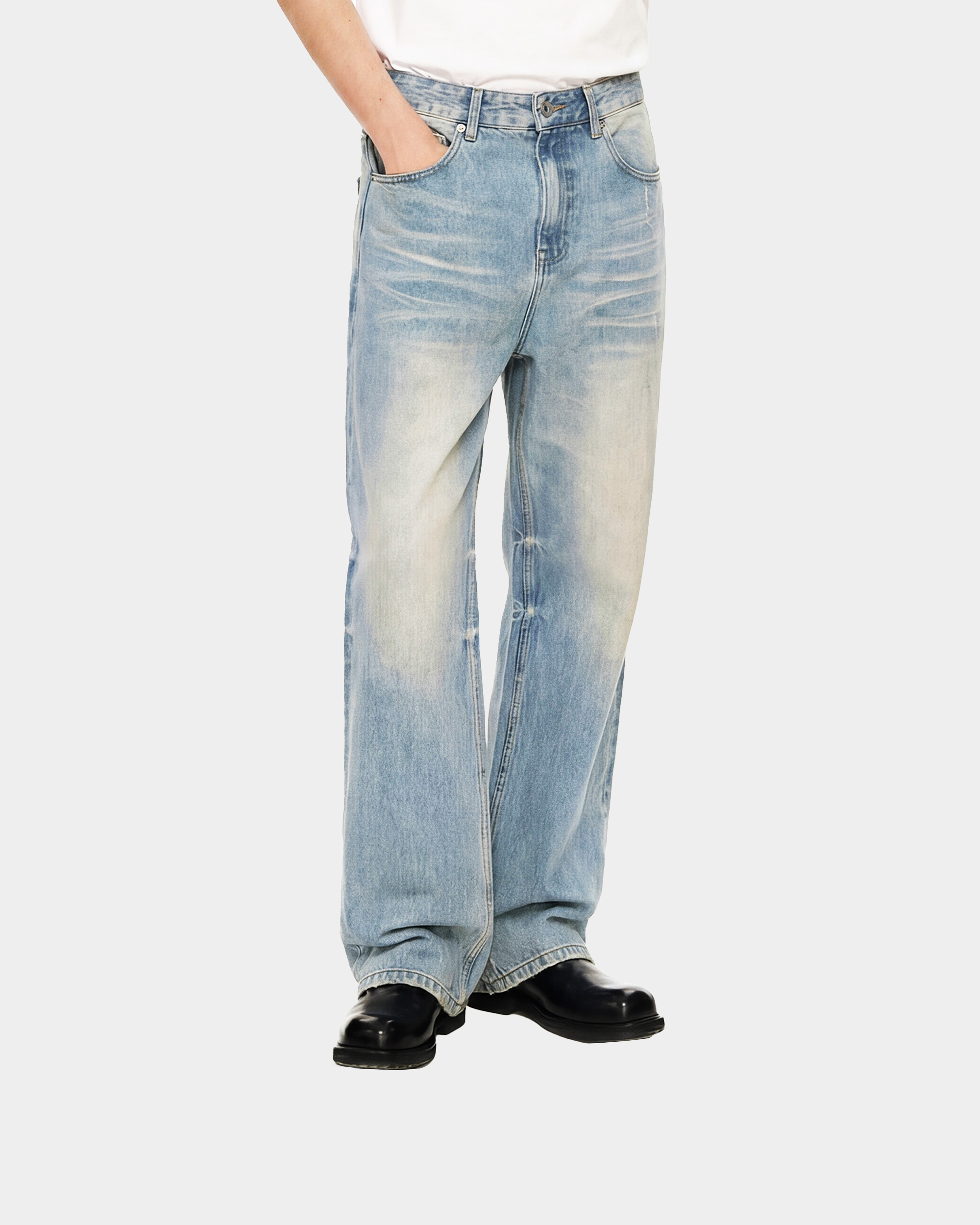 Sun-faded denim pants by Kaleb A. Bearden, featuring relaxed fit, distressed details, and a casual style in light blue denim.