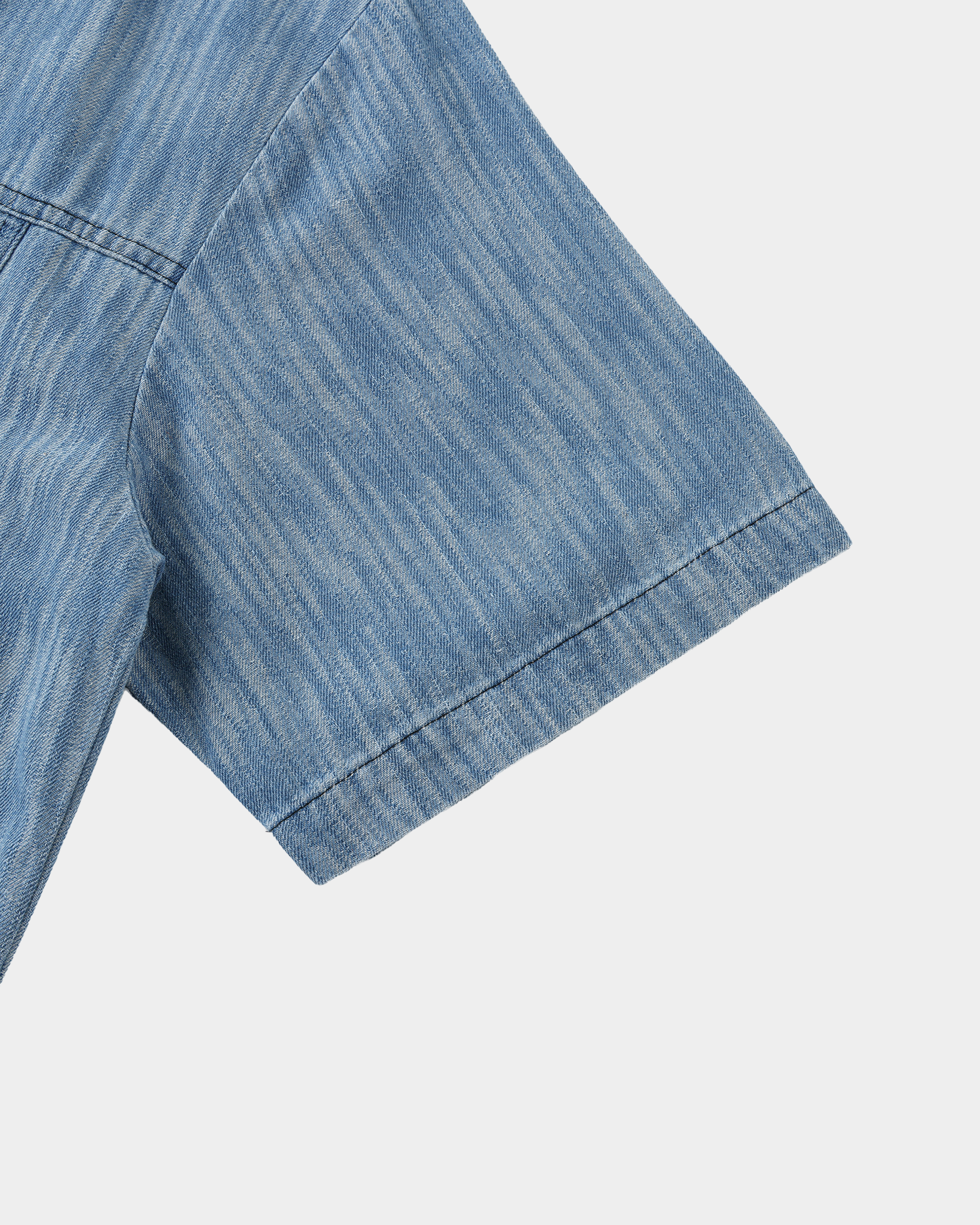 Washed denim panel shirt by Kaleb A. Bearden featuring a casual fit and front button closure with denim patchwork design.