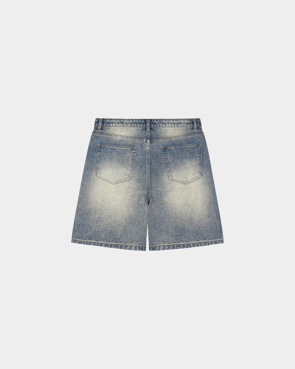 Faded baggy denim shorts by Kaleb A. Bearden with distressed details and relaxed fit, shown on a model.
