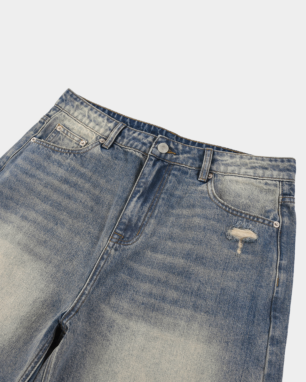 Faded baggy denim shorts by Kaleb A. Bearden featuring a relaxed fit and distressed details on light-wash denim.