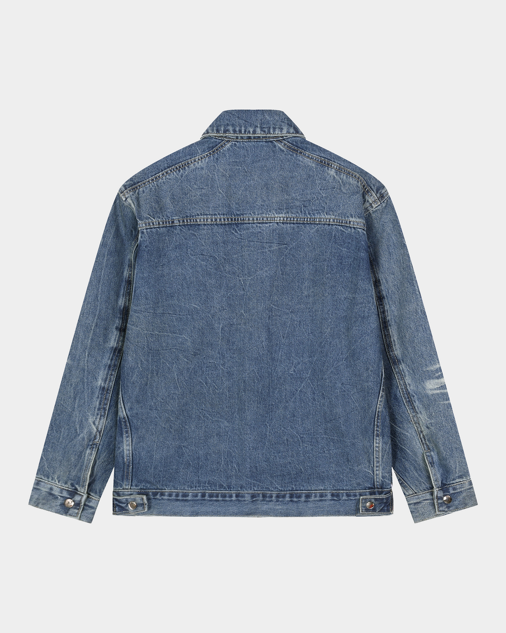 Kaleb A. Bearden washed denim jacket hanging on a rack, showcasing classic blue denim with a casual fit and button-front design.