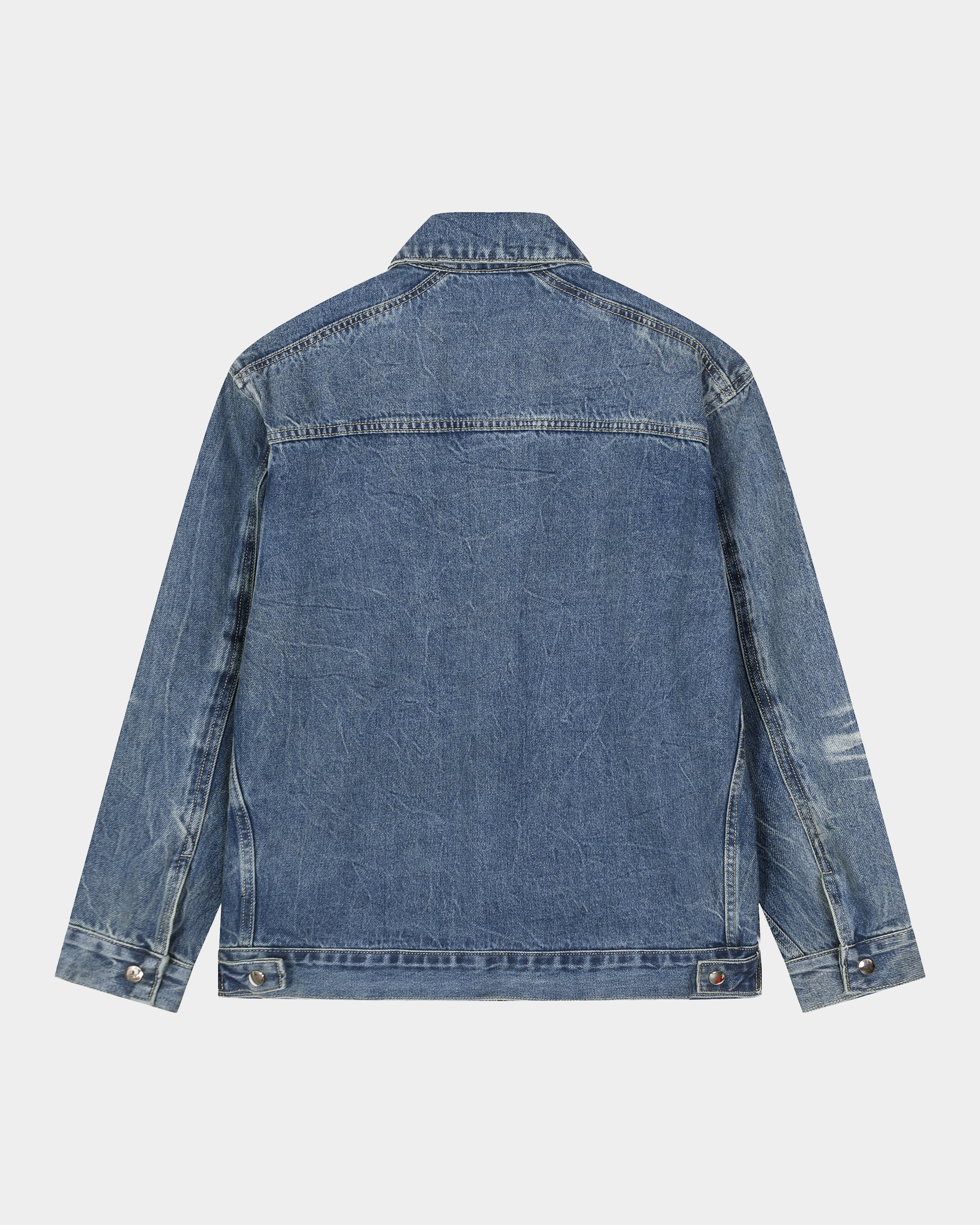 Kaleb A. Bearden washed denim jacket hanging on a rack, showcasing classic blue denim with a casual fit and button-front design.