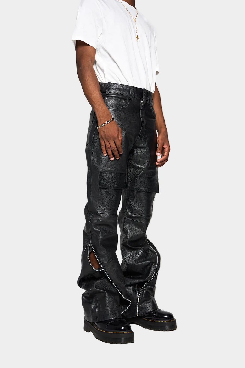 Kaleb A. Bearden zipped leather cargo pants showing multiple pockets and a sleek, fitted design in black leather.